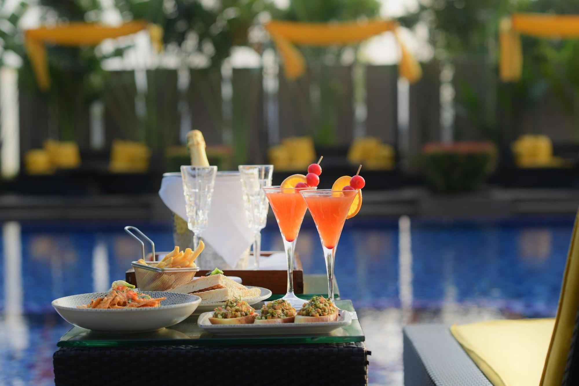 Radisson Blu Hotel Guwahati Exteriör bild Cocktails at the bar